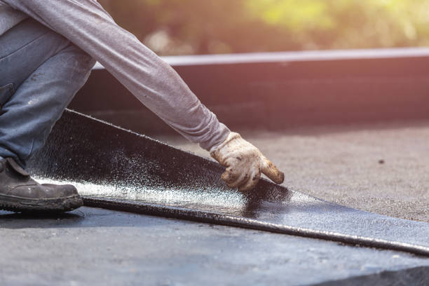 Professional Basement Waterproofing technician working in Grove City, PA